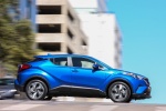 Picture of a driving 2018 Toyota C-HR in Blue Eclipse Metallic from a side perspective