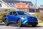 Picture of a driving 2018 Toyota C-HR in Blue Eclipse Metallic from a front right perspective