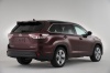 Picture of a 2015 Toyota Highlander Limited AWD in Ooh La La Rouge Mica from a rear right three-quarter perspective