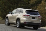 Picture of a 2015 Toyota Highlander Limited in Creme Brulee Mica from a rear left perspective