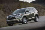 Picture of a driving 2015 Toyota Highlander Hybrid Limited AWD in Alumina Jade Metallic from a front left three-quarter perspective