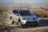 Picture of a driving 2014 Toyota RAV4 XLE in Classic Silver Metallic from a front right three-quarter perspective