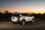 Picture of a 2014 Toyota RAV4 XLE in Classic Silver Metallic from a rear right three-quarter perspective