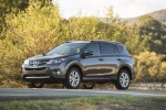 Picture of a driving 2014 Toyota RAV4 Limited in Magnetic Gray Pearl from a front left three-quarter perspective