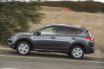 Picture of a driving 2014 Toyota RAV4 Limited in Magnetic Gray Pearl from a side perspective
