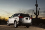 Picture of a 2015 Toyota RAV4 XLE in Classic Silver Metallic from a rear left three-quarter perspective