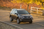 Picture of a driving 2015 Toyota RAV4 Limited in Magnetic Gray Pearl from a front right perspective