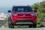 Picture of a driving 2016 Toyota RAV4 SE AWD in Barcelona Red from a frontal perspective