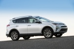 Picture of a driving 2016 Toyota RAV4 Limited AWD in Super White from a right side perspective