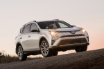 Picture of a driving 2016 Toyota RAV4 Limited AWD in Super White from a front right perspective