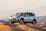 Picture of a driving 2016 Toyota RAV4 Limited AWD in Super White from a front left three-quarter perspective