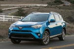 Picture of a driving 2016 Toyota RAV4 Hybrid Limited AWD in Electric Storm Blue from a front left perspective