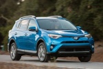 Picture of a driving 2016 Toyota RAV4 Hybrid Limited AWD in Electric Storm Blue from a front right three-quarter perspective