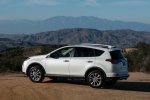 Picture of a driving 2016 Toyota RAV4 Limited AWD in Super White from a rear left three-quarter perspective