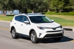 Picture of a driving 2016 Toyota RAV4 Limited AWD in Super White from a front right three-quarter perspective