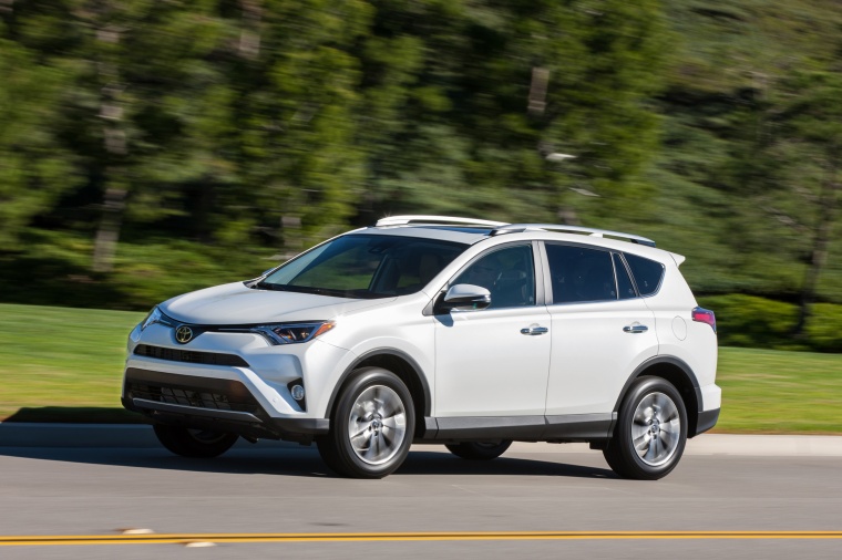 Picture of a driving 2017 Toyota RAV4 Limited AWD in Super White from a front left three-quarter perspective