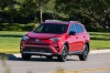 Picture of a driving 2017 Toyota RAV4 SE AWD in Barcelona Red from a front left perspective