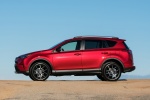 Picture of a driving 2017 Toyota RAV4 SE AWD in Barcelona Red from a left side perspective