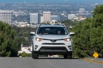Picture of a driving 2017 Toyota RAV4 Limited AWD in Super White from a frontal perspective
