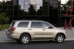 Picture of a 2016 Toyota Sequoia in Sandy Beach Metallic from a rear side perspective