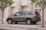 Picture of a 2016 Toyota Sequoia in Pyrite Mica from a rear left three-quarter perspective