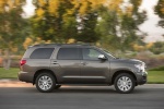 Picture of a driving 2016 Toyota Sequoia in Pyrite Mica from a right side perspective