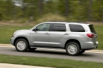 Picture of a driving 2016 Toyota Sequoia in Silver Sky Metallic from a rear left three-quarter perspective