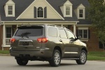 Picture of a 2017 Toyota Sequoia in Pyrite Mica from a rear left three-quarter perspective