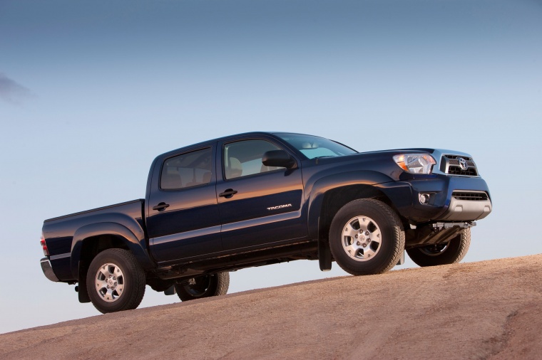 Picture of a 2014 Toyota Tacoma Double Cab SR5 V6 4WD in Blue Ribbon Metallic from a side perspective