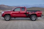 Picture of a 2014 Toyota Tacoma Access Cab V6 4WD in Barcelona Red Metallic from a side perspective