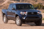 Picture of a driving 2014 Toyota Tacoma Double Cab SR5 V6 4WD in Blue Ribbon Metallic from a front right perspective