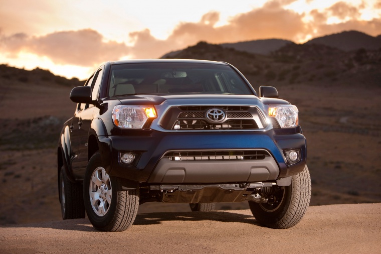 Picture of a 2015 Toyota Tacoma Double Cab SR5 V6 4WD in Blue Ribbon Metallic from a front right perspective