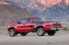 Picture of a 2015 Toyota Tacoma Access Cab V6 4WD in Barcelona Red Metallic from a rear left three-quarter perspective
