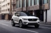 Picture of a driving 2019 Volvo XC40 T5 R-Design AWD in Crystal White Metallic from a front right perspective