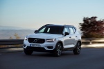 Picture of a driving 2019 Volvo XC40 T5 R-Design AWD in Crystal White Metallic from a front left three-quarter perspective