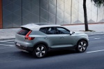 Picture of a driving 2019 Volvo XC40 T5 Momentum AWD in Amazon Blue from a rear right three-quarter top perspective