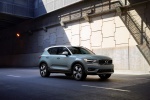 Picture of a driving 2019 Volvo XC40 T5 Momentum AWD in Amazon Blue from a front right three-quarter perspective
