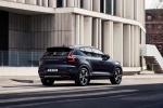 Picture of a driving 2019 Volvo XC40 T5 Inscription AWD in Denim Blue Metallic from a rear right three-quarter perspective