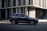 Picture of a driving 2019 Volvo XC40 T5 Inscription AWD in Denim Blue Metallic from a side perspective